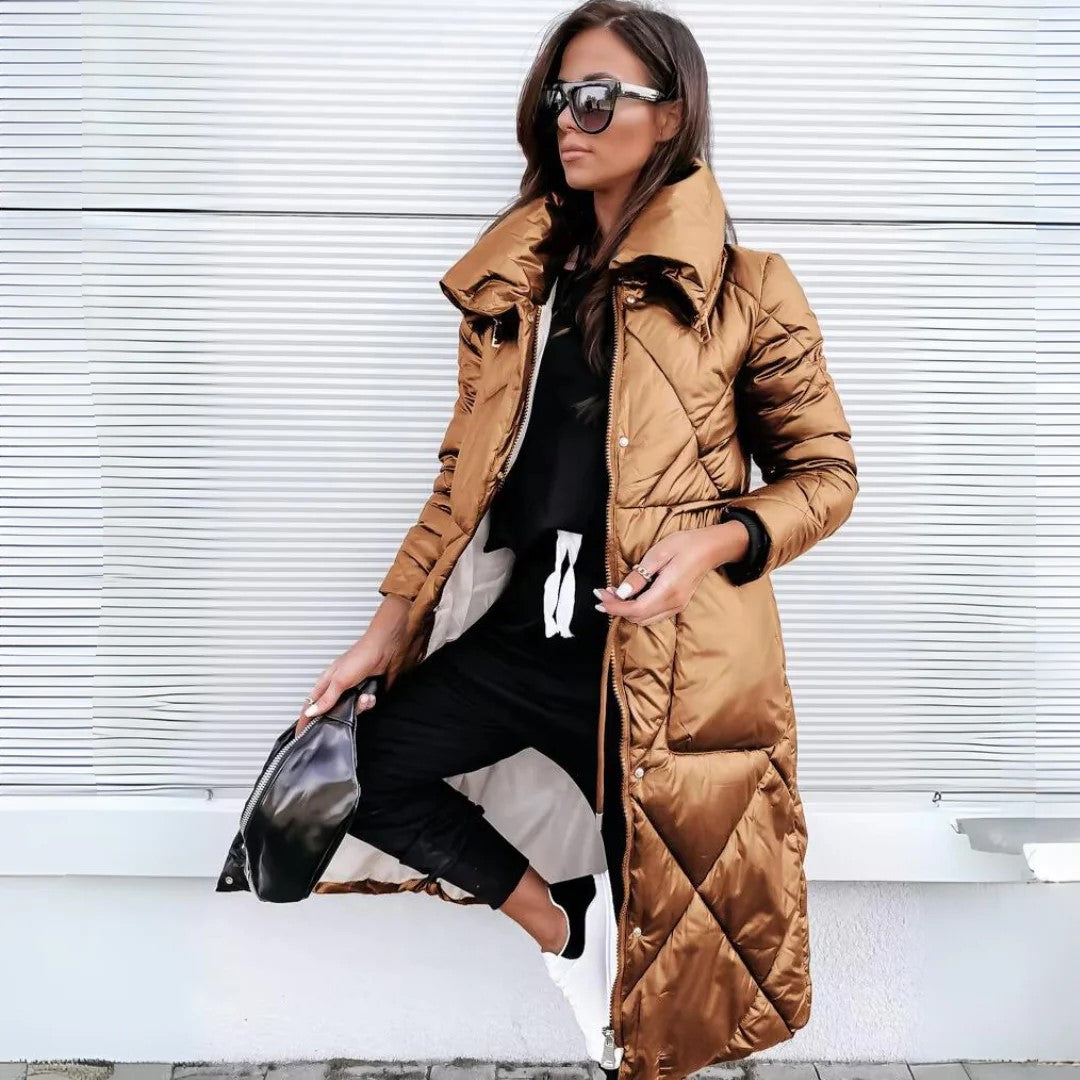 The Monique Luxurious Winter Coat combines elegant design with practical features like a secure hood and spacious pockets for all-day comfort.