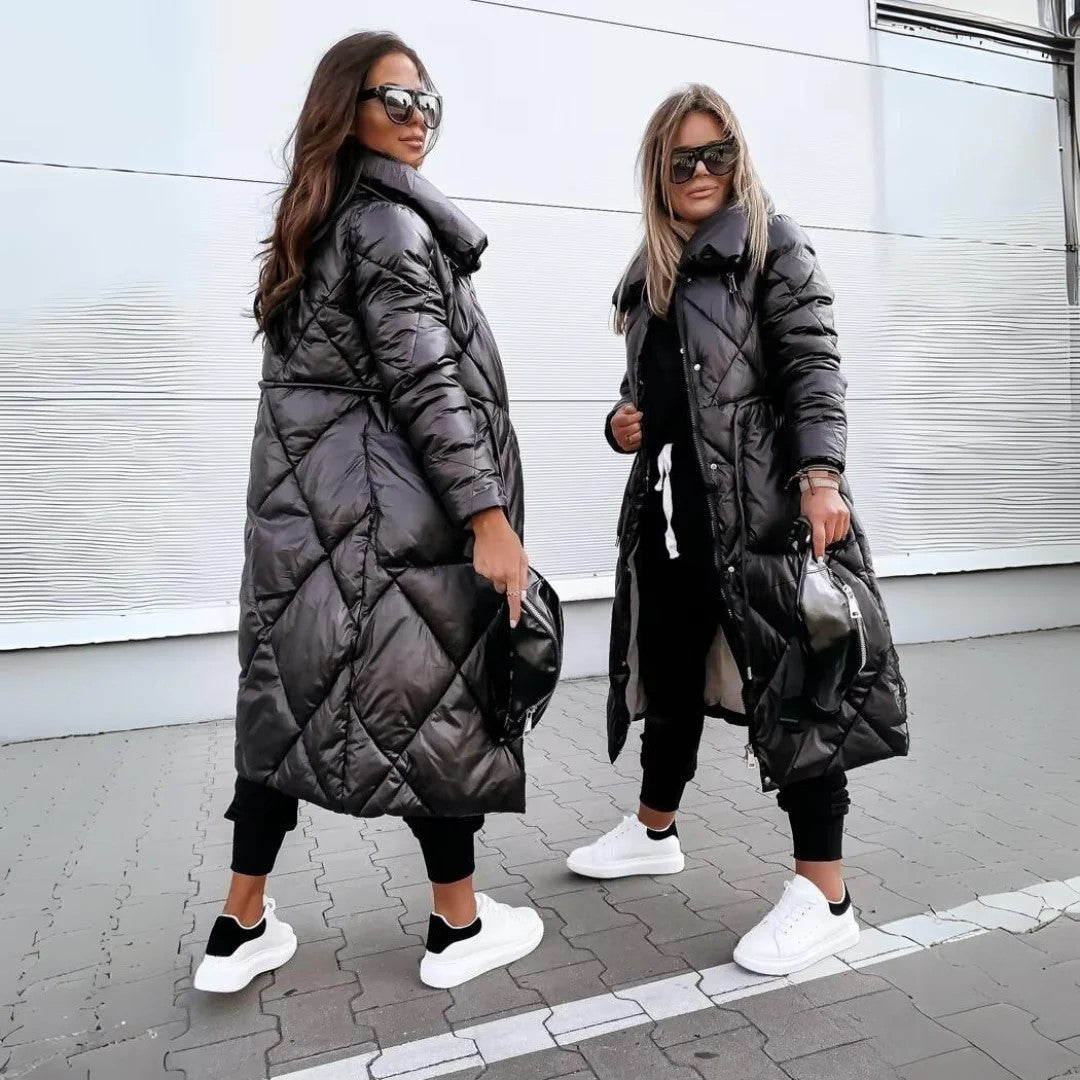 The Monique Winter Coat offers a flattering, long, and tailored fit, perfect for showcasing your silhouette while staying warm and comfortable.