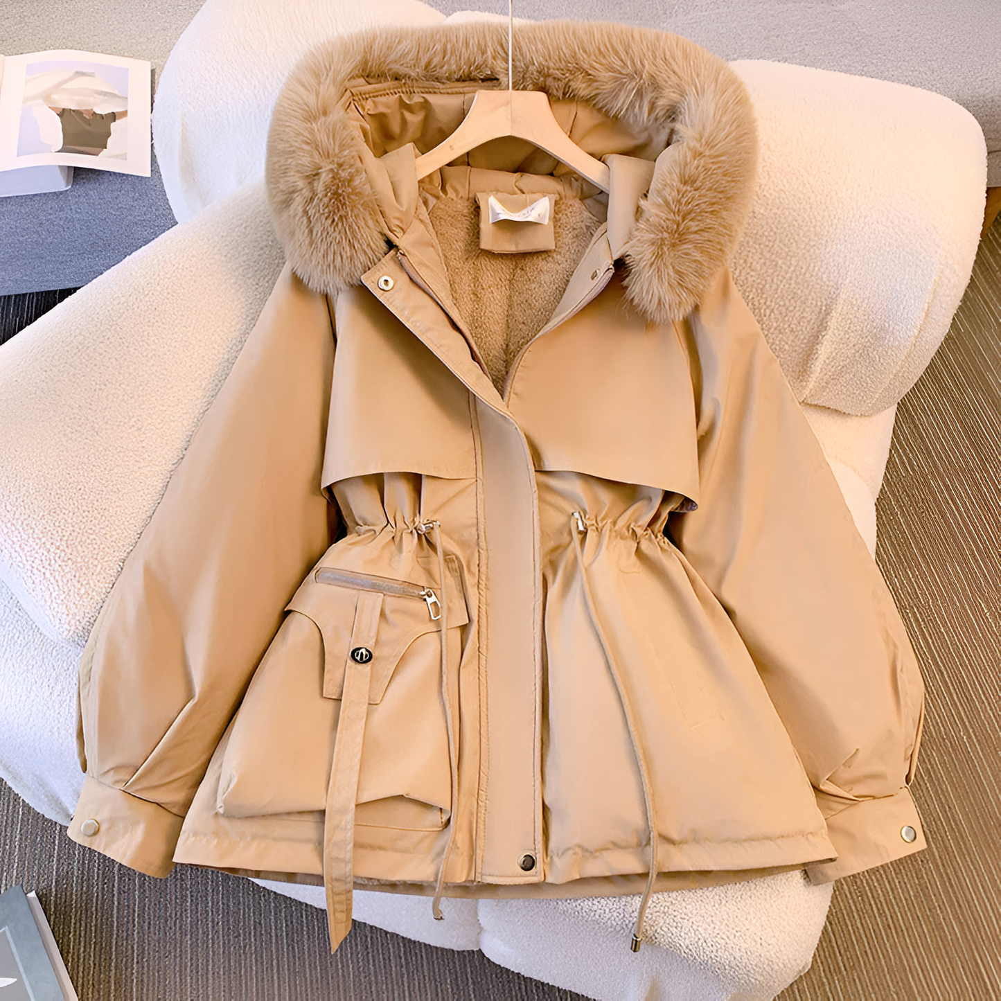 Insulated hood and high collar on the Nicole winter coat, offering extra warmth and protection from the elements.