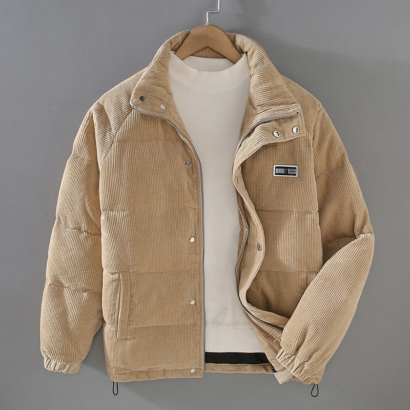 TOMMY™ Cord Jacket in (beige) earthy olive, highlighting its versatile style and practicality, worn over a casual outfit for an outdoor adventure.