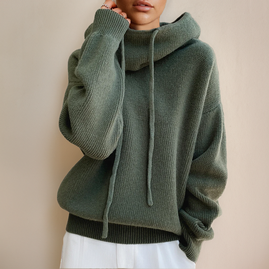 The Giselle Hooded Knit Sweater in soft, warm fabric, perfect for keeping cozy during cold weather. A stylish option for casual and layered outfits.