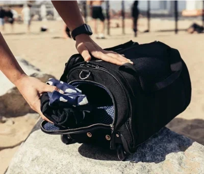 Traveler using the Jude™ Multifunctional Travel Bag, demonstrating its practical design and stylish look.