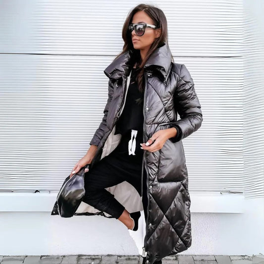 The Monique Luxurious Winter Coat with a tailored fit and insulated lining, offering warmth and style for cold weather. Perfect for elegant winter outings.