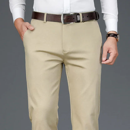 A collection of black, navy blue, and khaki men's chinos, offering versatile colour.