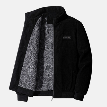 the Retro Cord Jacket in black, emphasizing its sleek design and tailored fit.