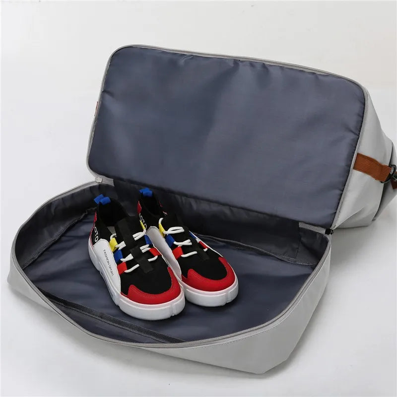 Travel duffle bag featuring a dedicated compartment for shoes or other items, keeping your gear organized and separate from the main storage.