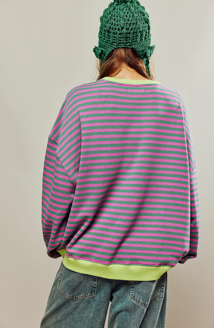 Oversized sweater with bold stripes, making a statement in casual fashion.