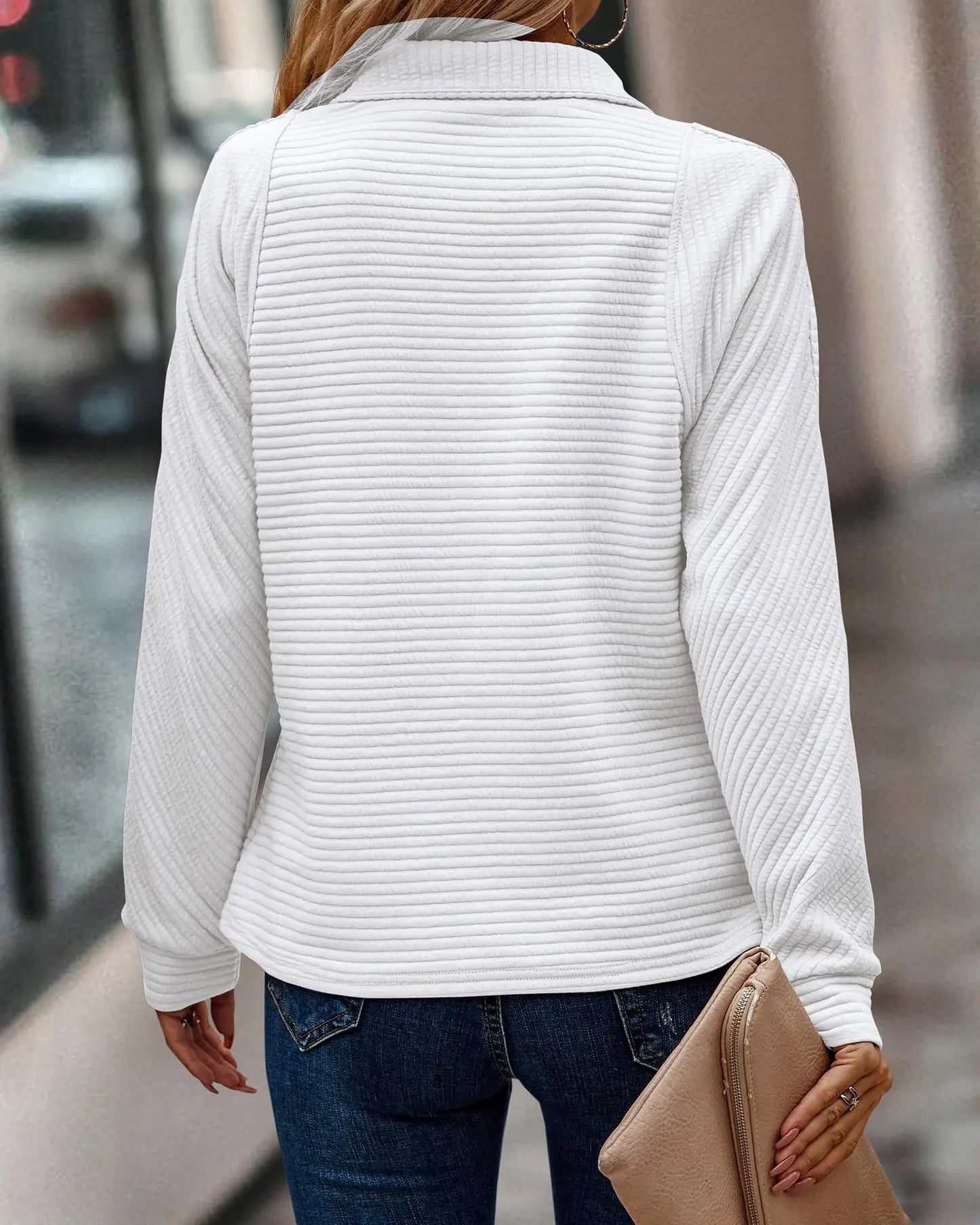 A must-have addition to your wardrobe, this V-neck sweater combines style and comfort for everyday wear.