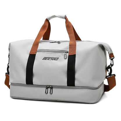 Durable gray travel bag with a versatile design, featuring a convenient luggage sleeve and ample packing space.