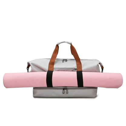 Travel duffle bag with a dedicated slot for holding a rolled yoga mat, perfect for fitness enthusiasts on the go.